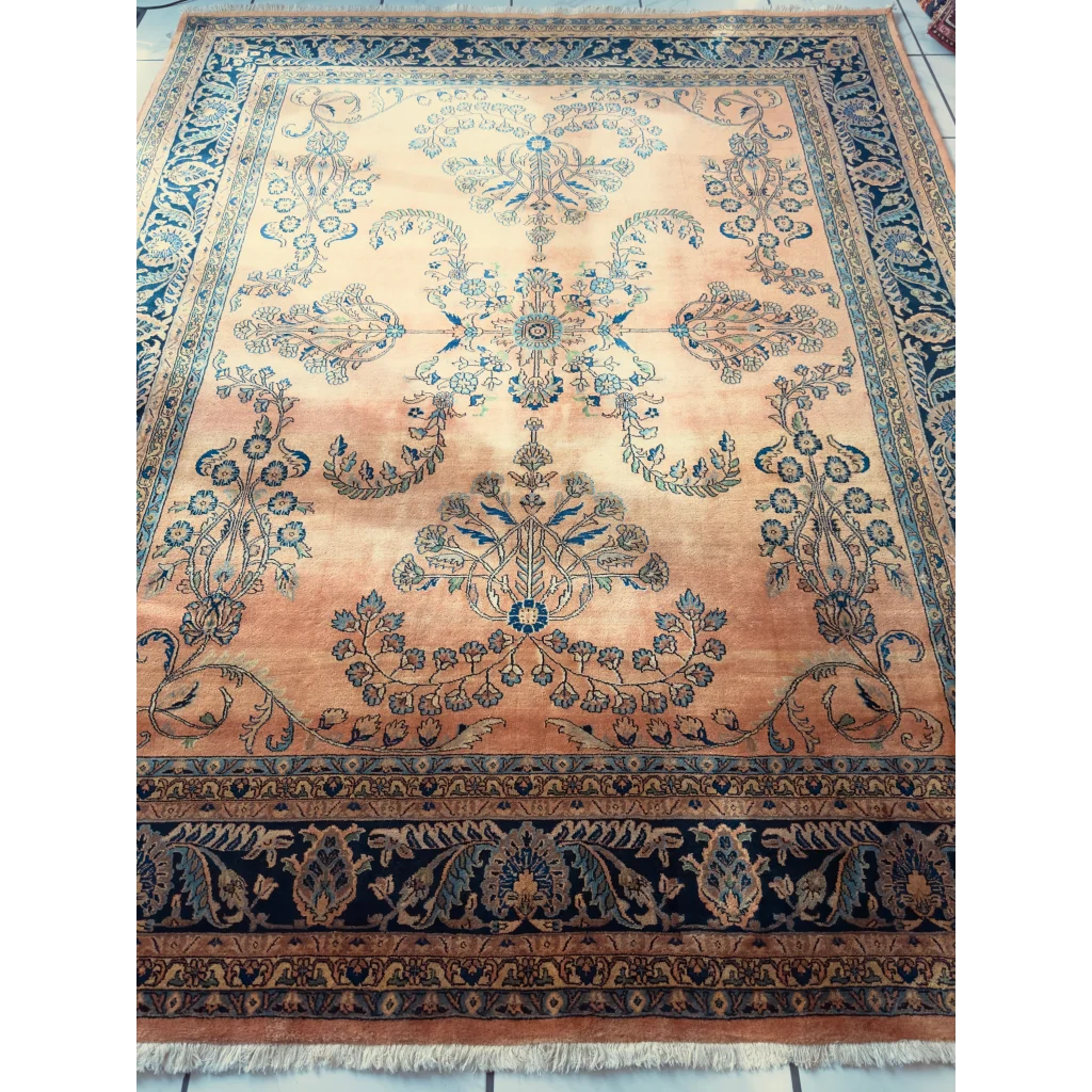 Stunning hand-knotted wool rug with navy border and peach florals
