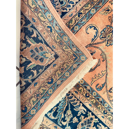 Stunning hand-knotted wool rug with navy border and peach florals