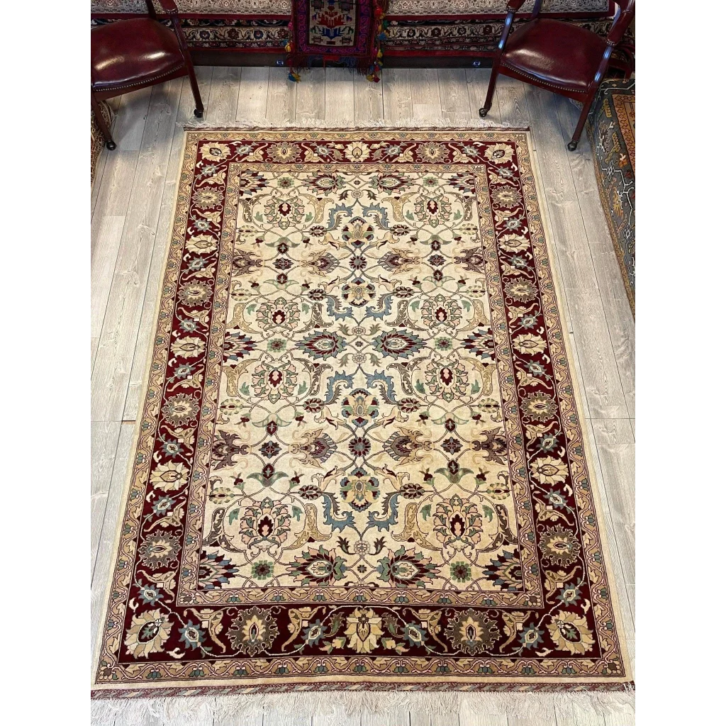 Stunning beige and burgundy Afghan rug with floral patterns, natural dyes