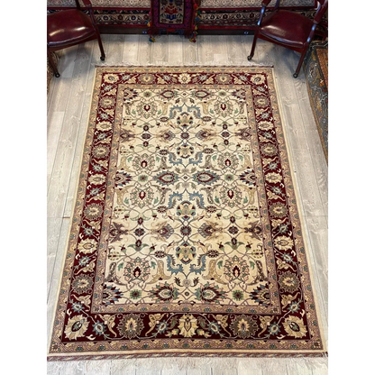 Stunning beige and burgundy Afghan rug with floral patterns, natural dyes