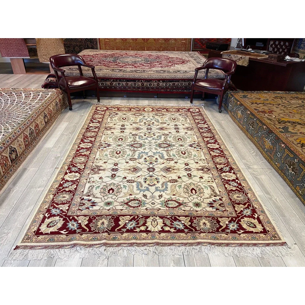 Stunning hand-woven Afghan rug from Northwestern Afghanistan with natural dyes, cream and burgundy floral patterns