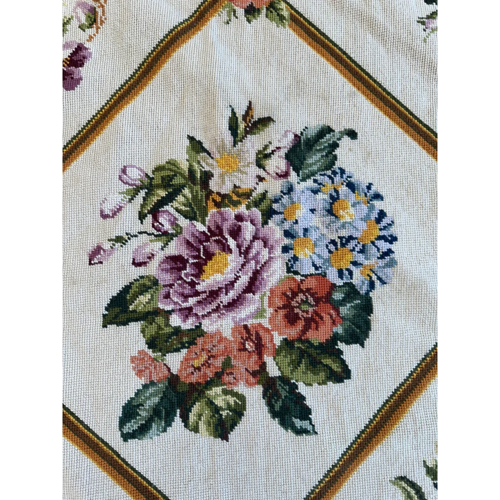 Cream-colored handmade needlepoint tapestry style floral bouquet rug
