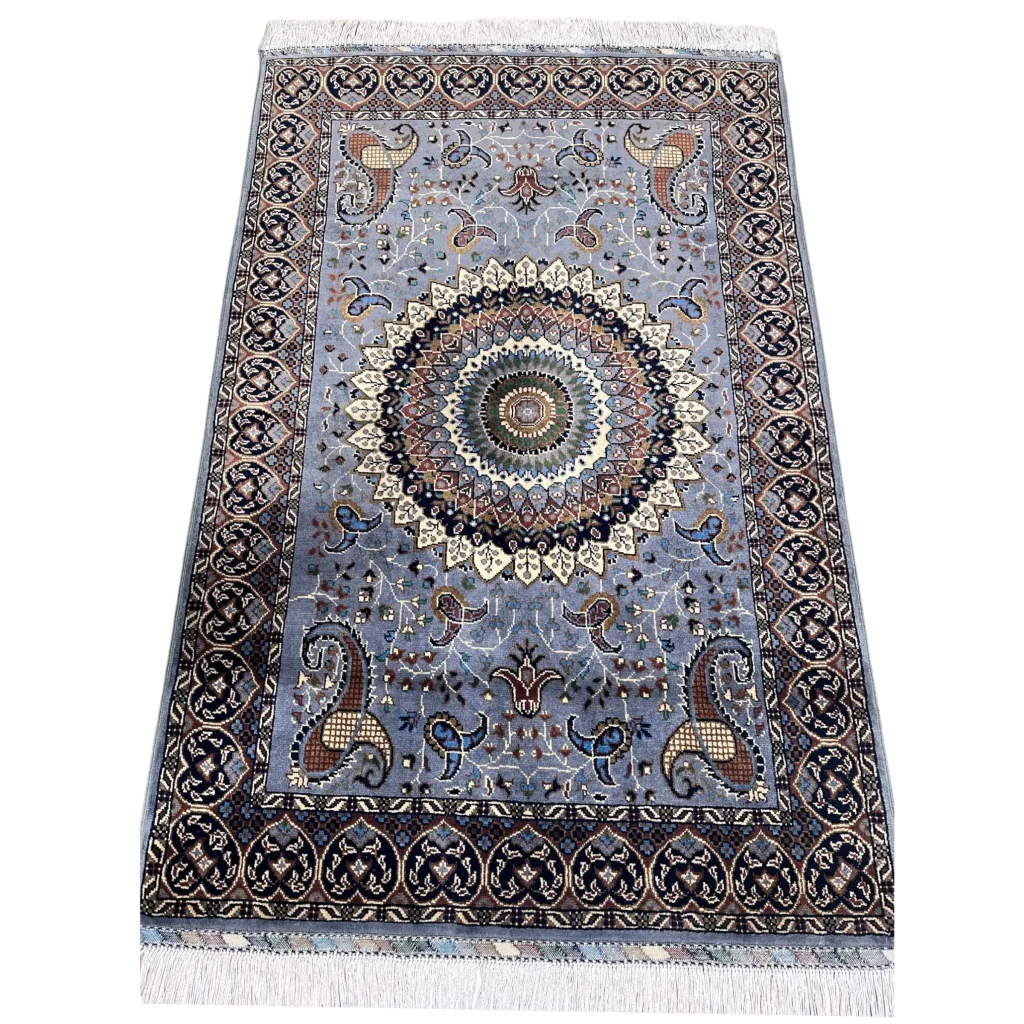 Stunning handwoven Parak rug in light blue with mandala and paisley design