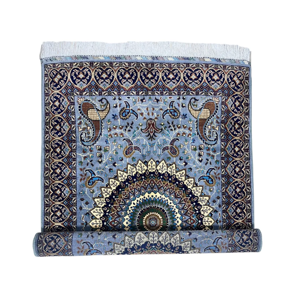 Stunning handwoven Parak rug in light blue with paisley mandala design