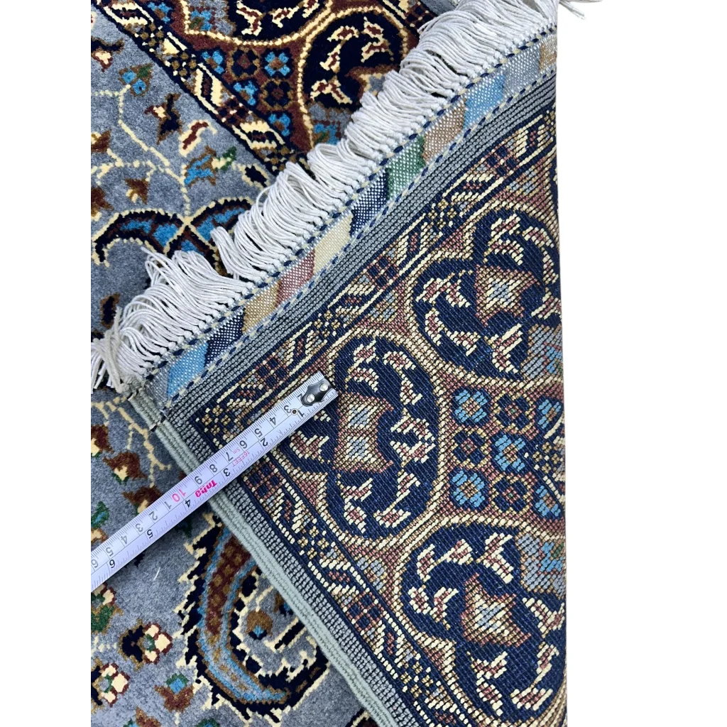 Stunning handwoven Parak rug in blue-brown with floral motifs and fringe