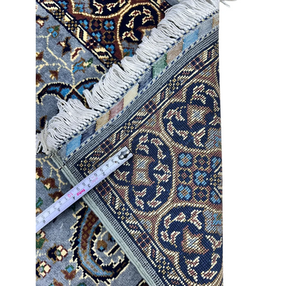 Stunning handwoven Parak rug in blue-brown with floral motifs and fringe