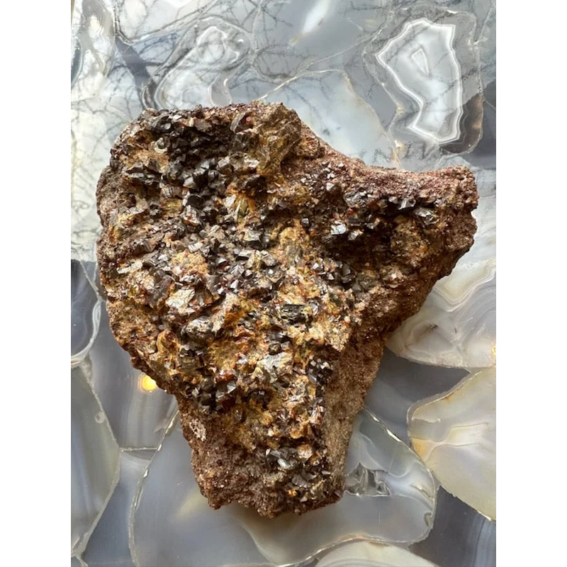 Rugged hessonite garnet cluster from Washington State with earthy tones