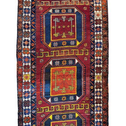 Vintage Kurdish Kazak geometric runner 1940s, close-up of bold red and blue field pattern