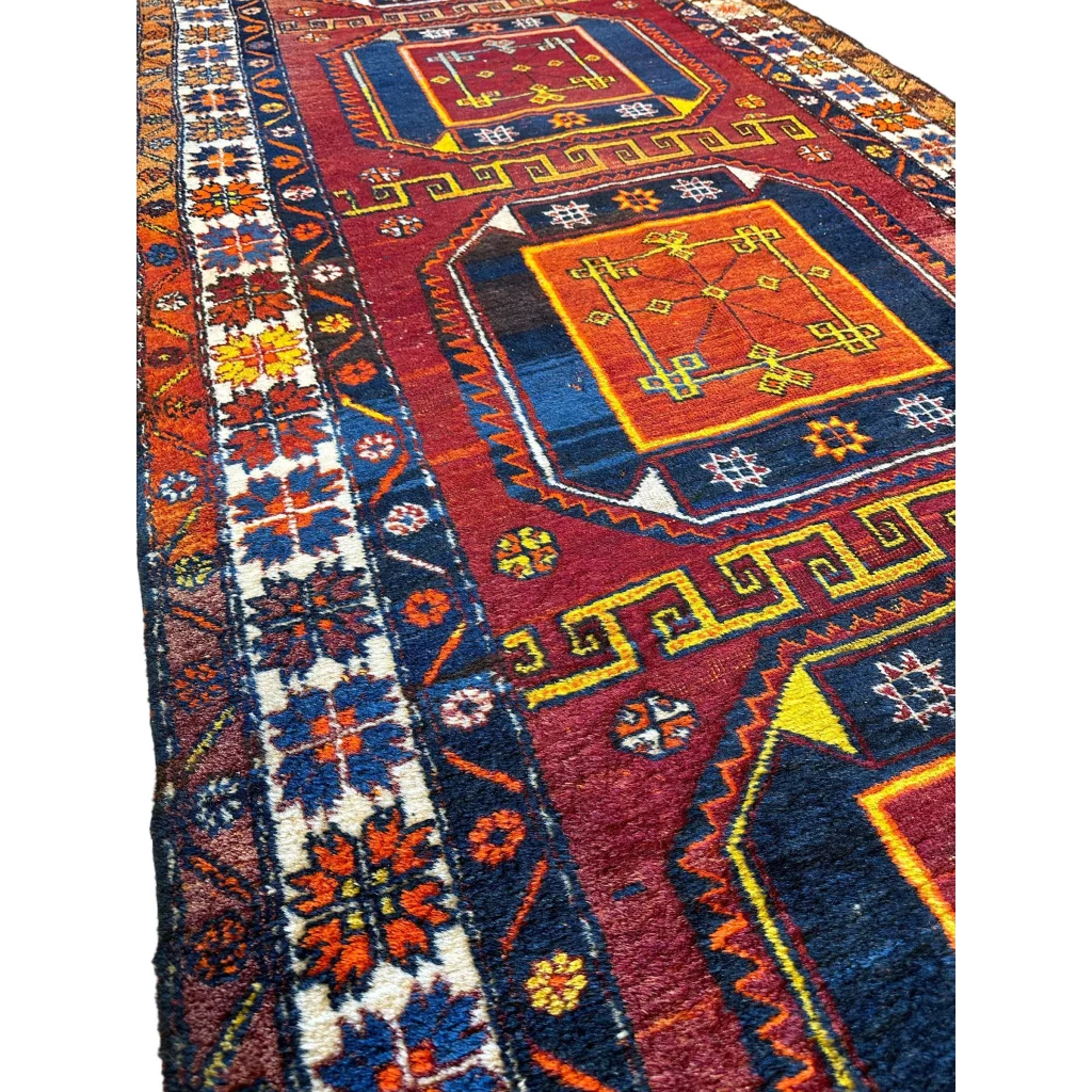 Vintage Kurdish Kazak runner 1940s, vibrant geometric motifs in red blue yellow, pre-loved low pile