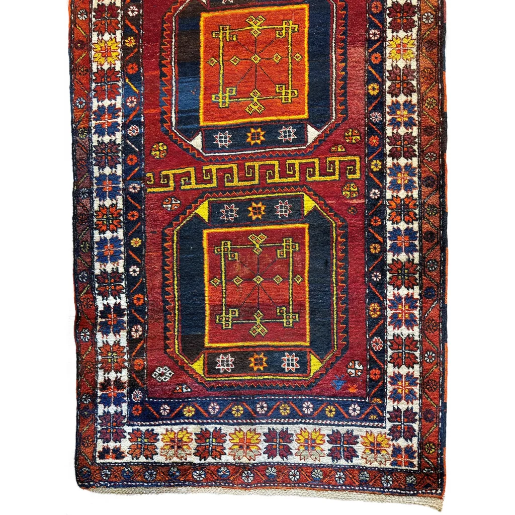 1940s Caucasian Kurdish Kazak runner, field view of geometric motifs in red blue and yellow