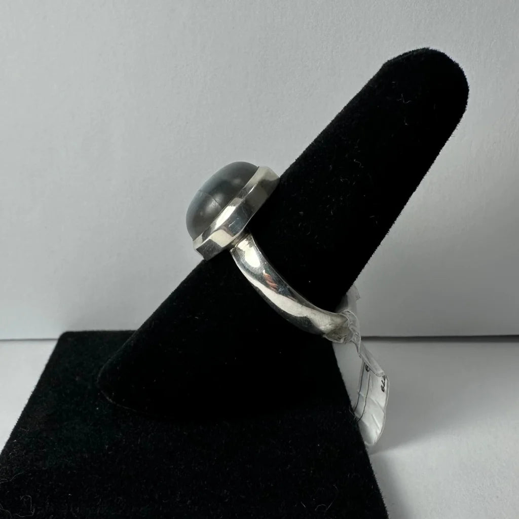 Stunning labradorite ring with silver bezel and iridescent blue green flash