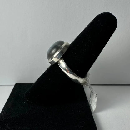 Stunning labradorite ring with silver bezel and iridescent blue green flash