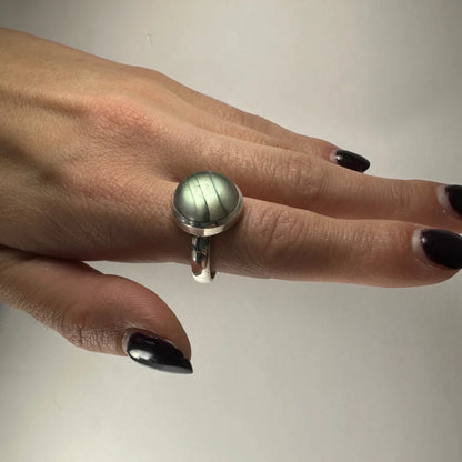 Sleek silver labradorite ring with iridescent blue green flash