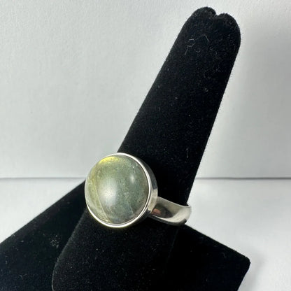 Stunning labradorite ring with oval silver band and iridescent green blue shimmer