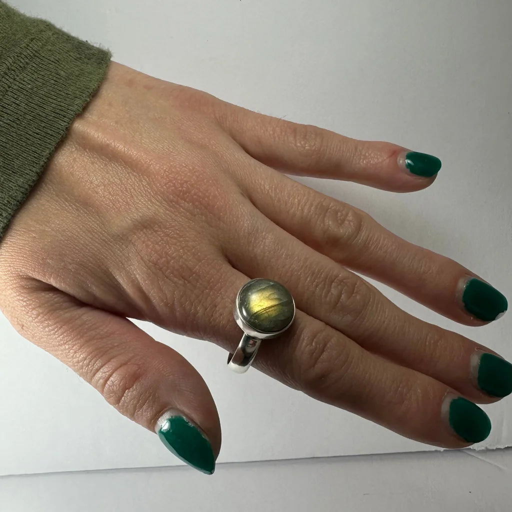 Stunning silver labradorite ring with iridescent green and gold flashes