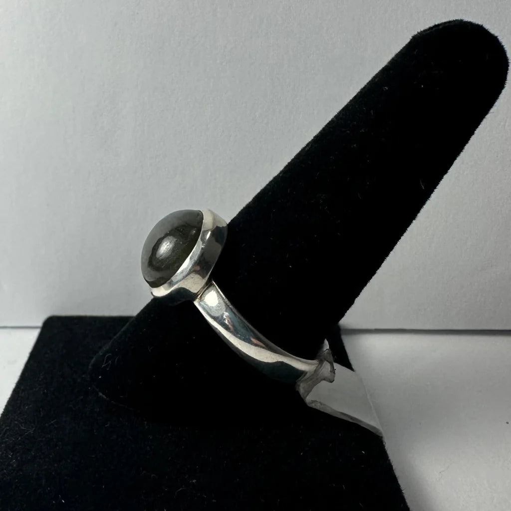 Stunning labradorite ring with silver band and gray domed stone