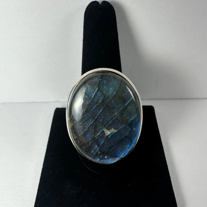 Stunning labradorite ring with oval silver-toned band and iridescent blue-gray stone
