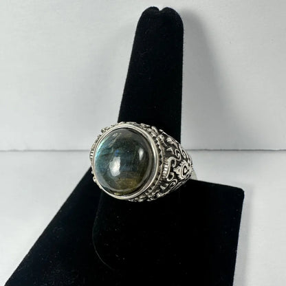 Stunning labradorite ring with ornate filigree and iridescent blue-green cabochon