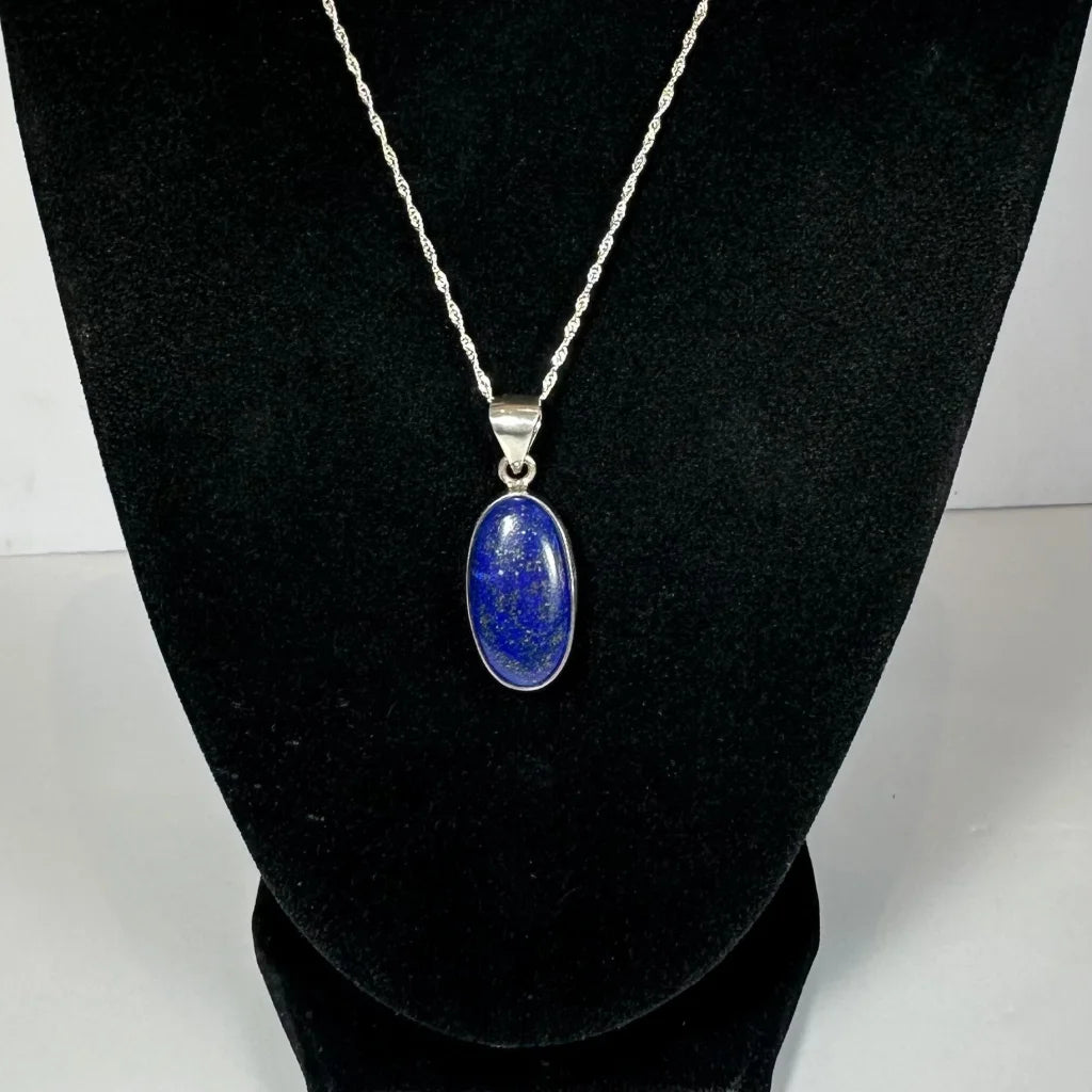 Stunning lapis lazuli pendant in sterling silver chain with oval blue stone