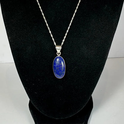 Stunning lapis lazuli pendant in sterling silver chain with oval blue stone