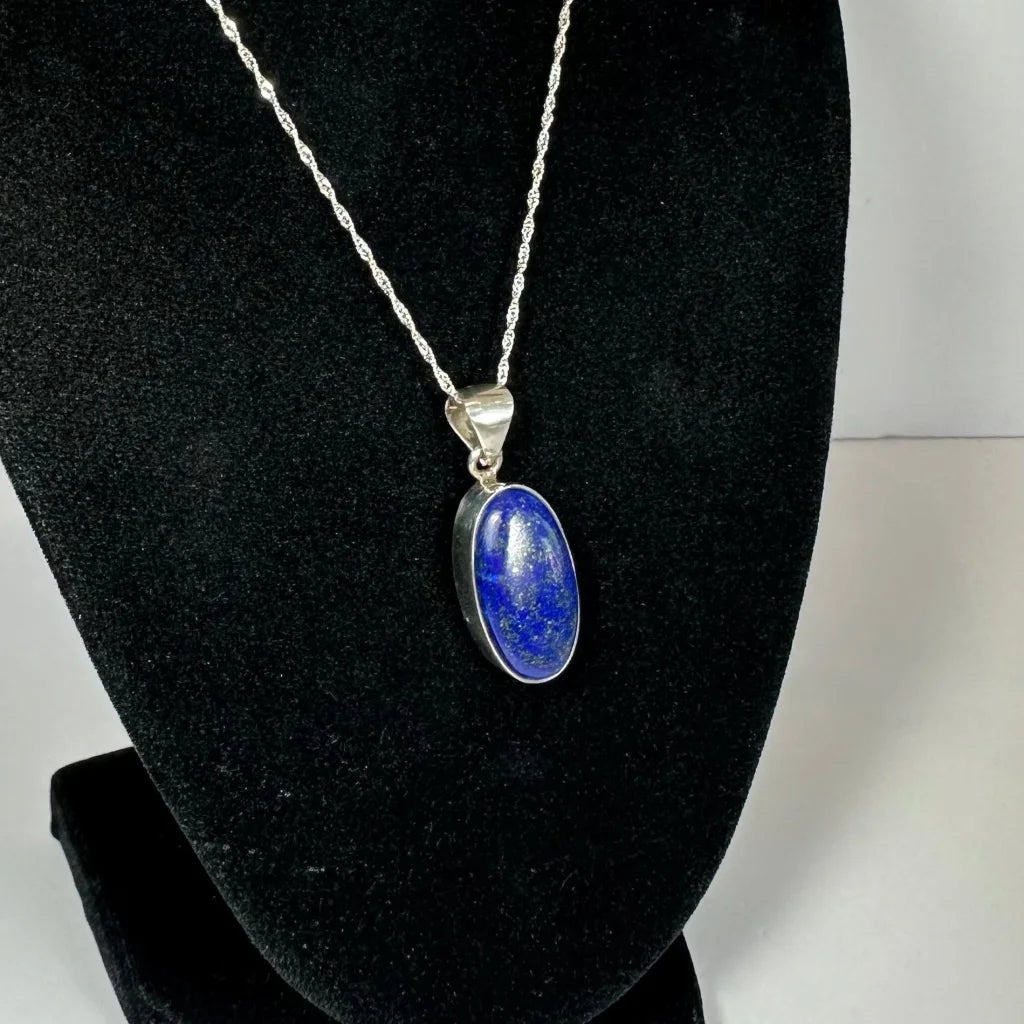 Stunning lapis lazuli pendant in sterling silver chain with oval blue stone