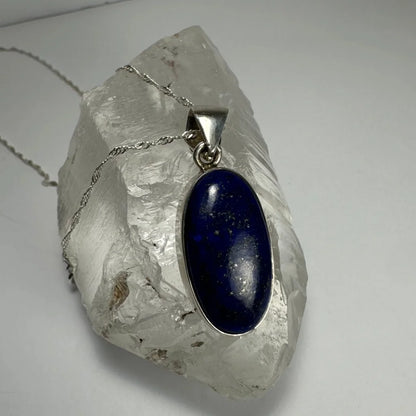 Stunning lapis lazuli pendant in sterling silver with deep blue oval stone