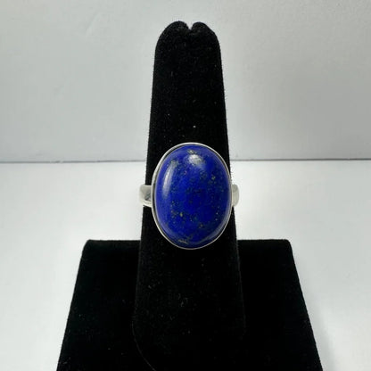 Stunning oval lapis lazuli ring in sterling silver, size 7 on black velvet
