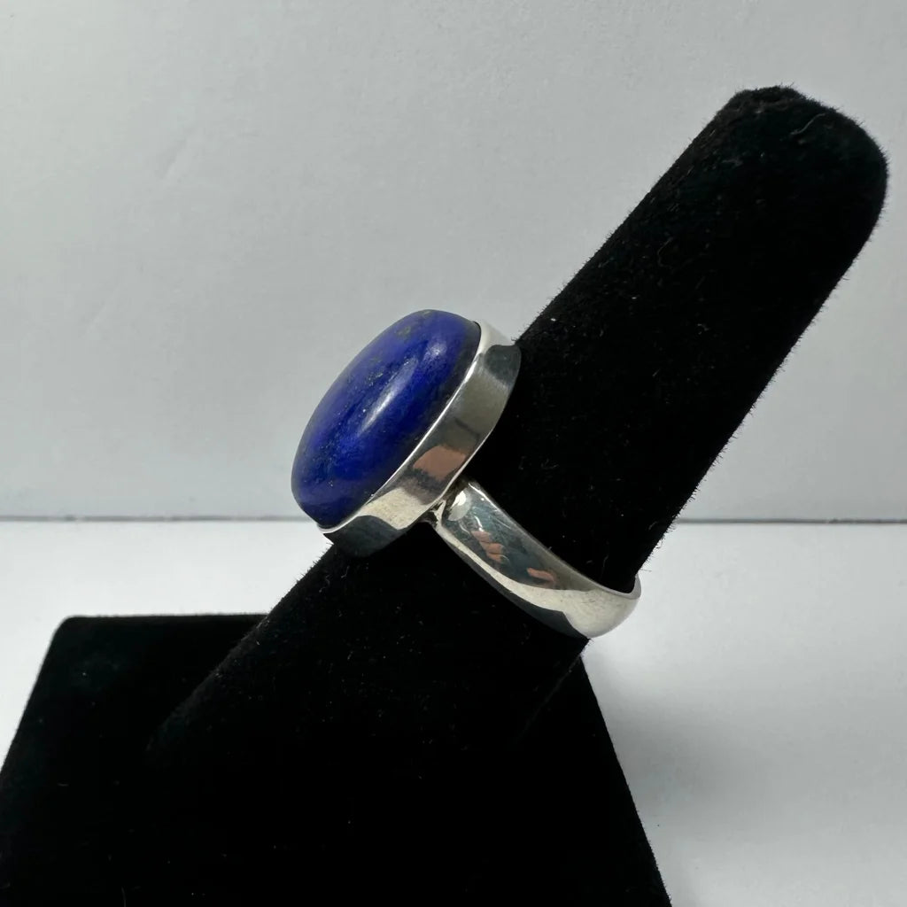 Sleek silver lapis lazuli ring with oval blue stone, size 7