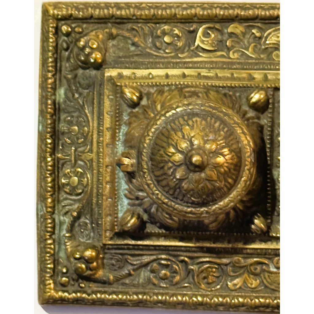 Ornate aged brass double inkwell desk accessory from late 19th century