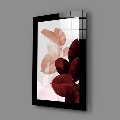 Sleek black-framed glass wall art with layered translucent peach and burgundy leaves