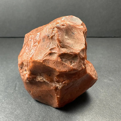 Stunning mahogany obsidian natural stone specimen with rough reddish-brown irregular shape and mineral veins
