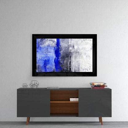 Stunning blue abstract glass wall art in gray tones with black frame