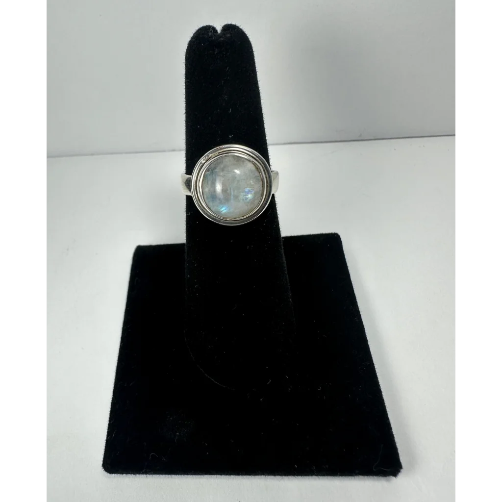 Stunning silver moonstone ring with blue shimmer in bezel setting
