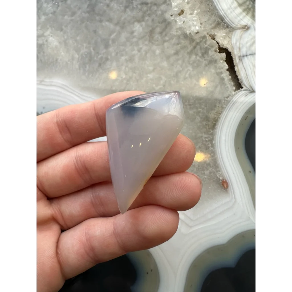 Stunning moss agate cabochon with dreamy blue veining