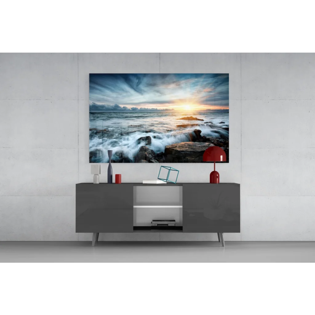 Vibrant ocean sunset glass wall art with crashing waves on rocks