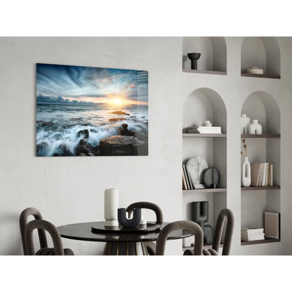 Stunning ocean sunset glass wall art with crashing waves on white wall
