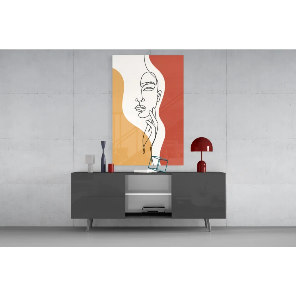 Modern gray sideboard with silver legs under orange abstract woman face wall art