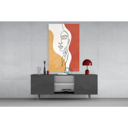 Modern gray sideboard with silver legs under orange abstract woman face wall art