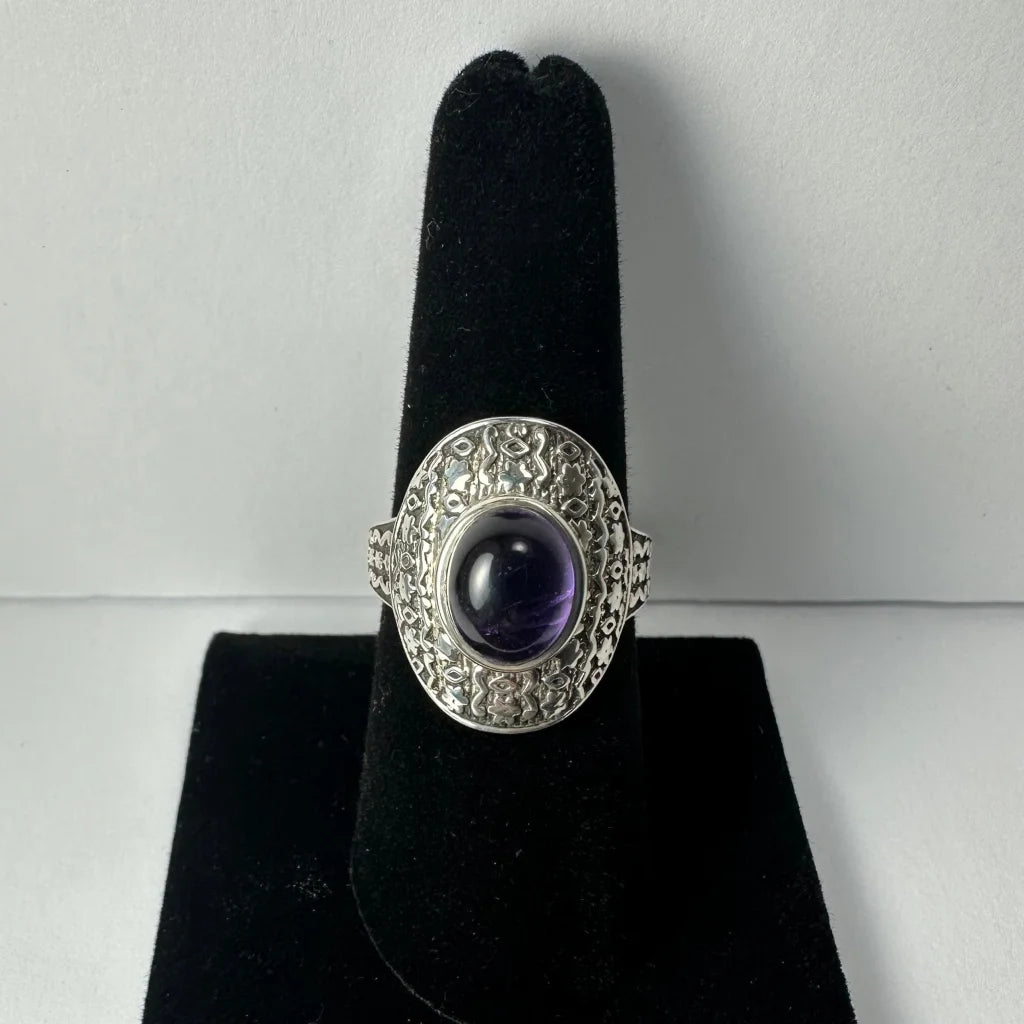 Stunning oval amethyst ring with ornate silver filigree band