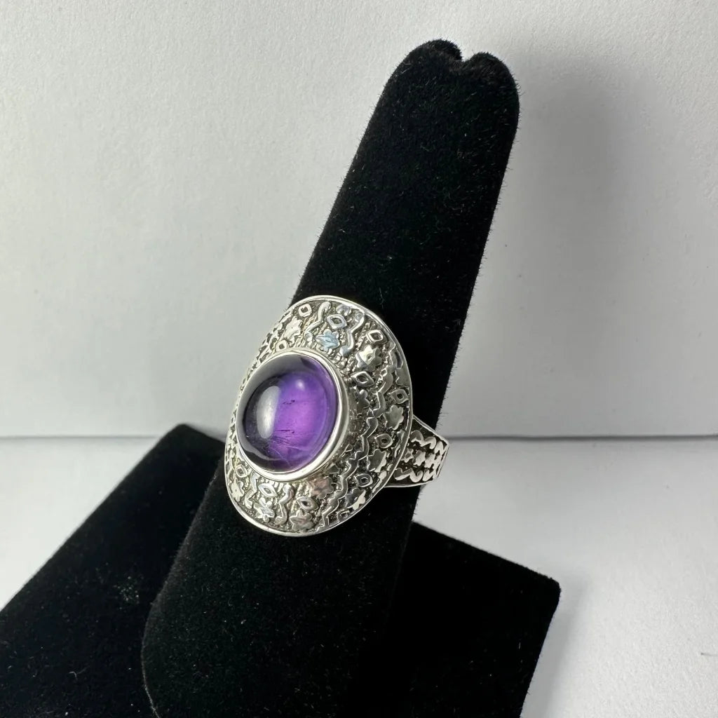 Stunning oval amethyst ring with ornate silver filigree band