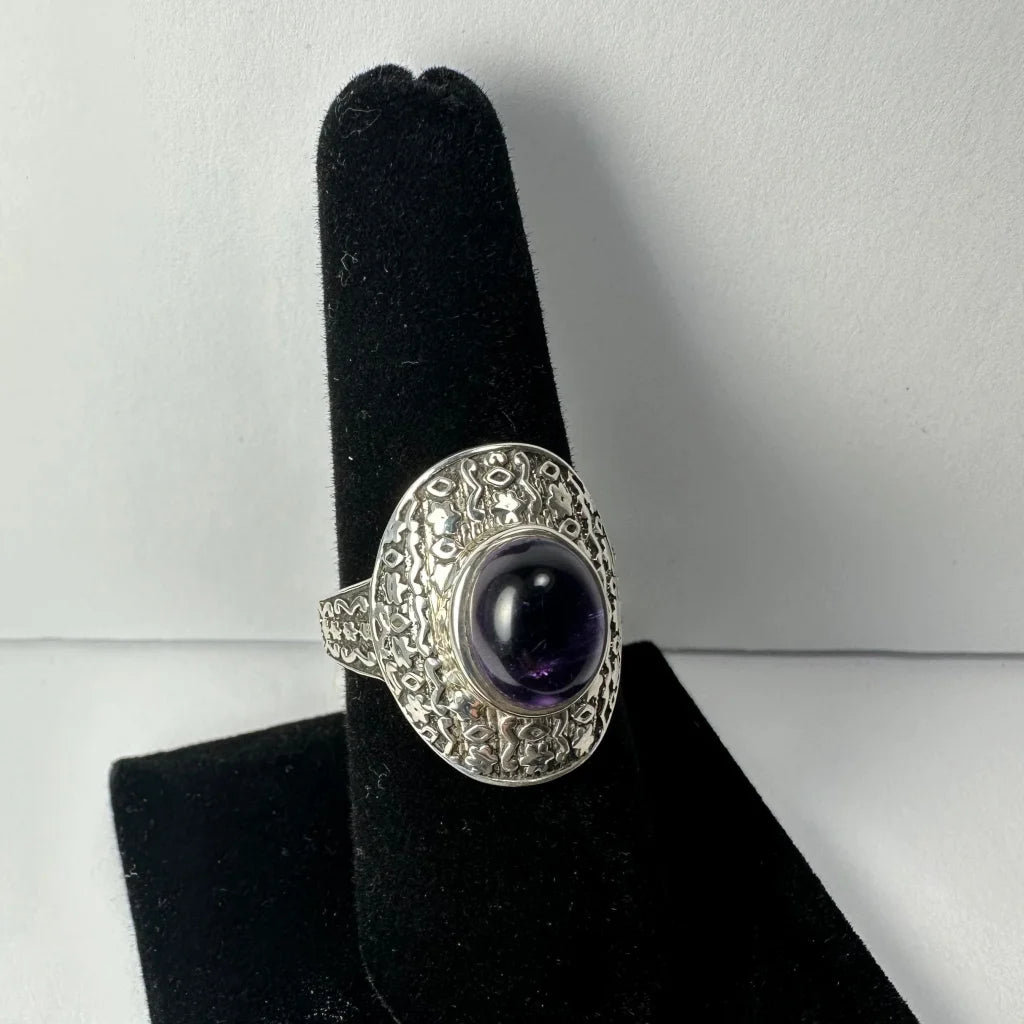 Stunning oval amethyst ring with ornate silver filigree band