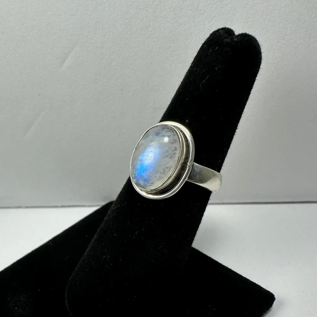Stunning oval moonstone ring in sterling silver with iridescent blue hues