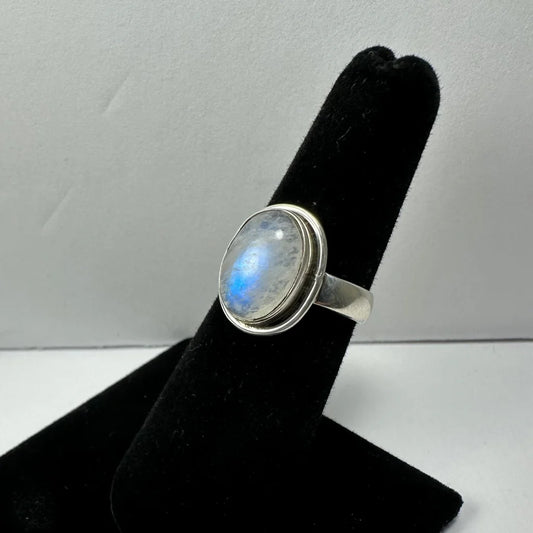 Stunning oval moonstone ring in sterling silver with iridescent blue hues