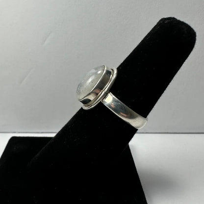 Sleek oval moonstone ring in sterling silver with bezel setting