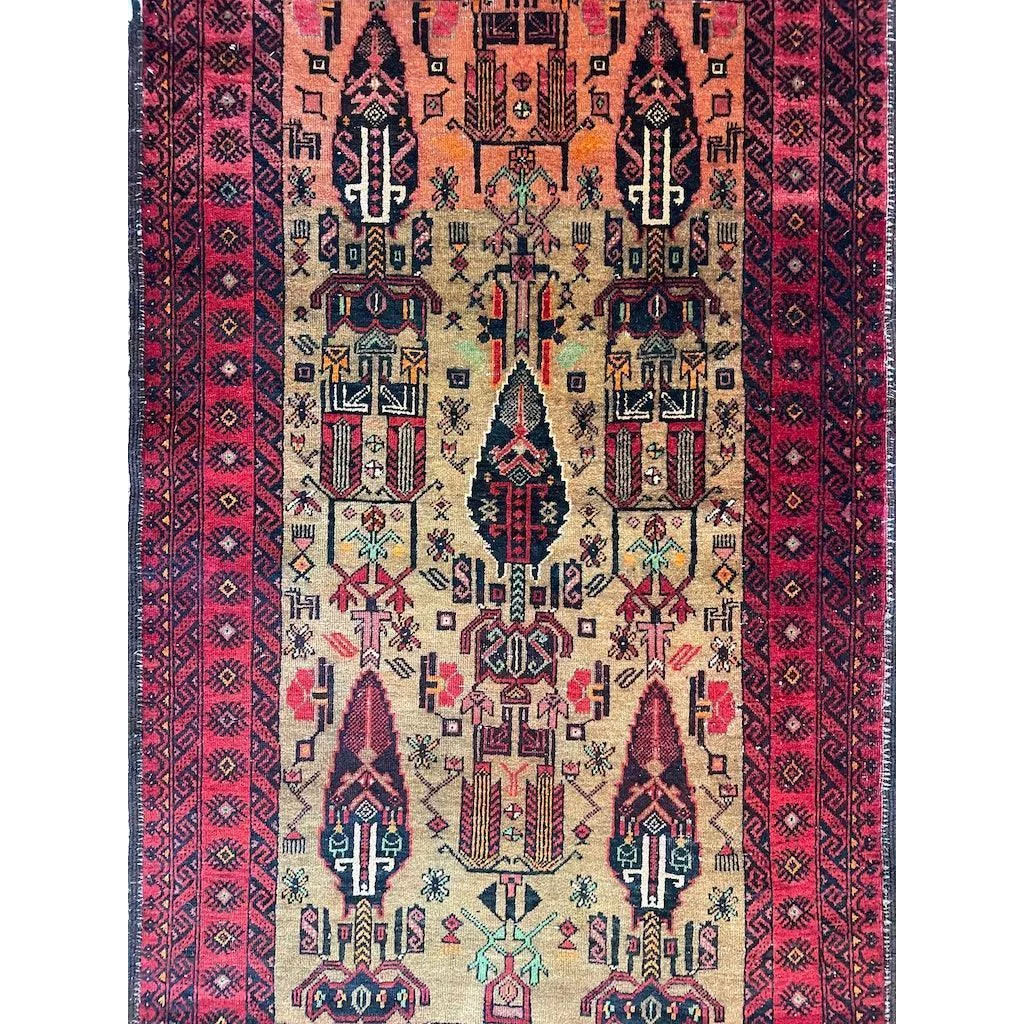 Vintage 1970s Persian Baluch rug with intricate geometric patterns and natural wool pile