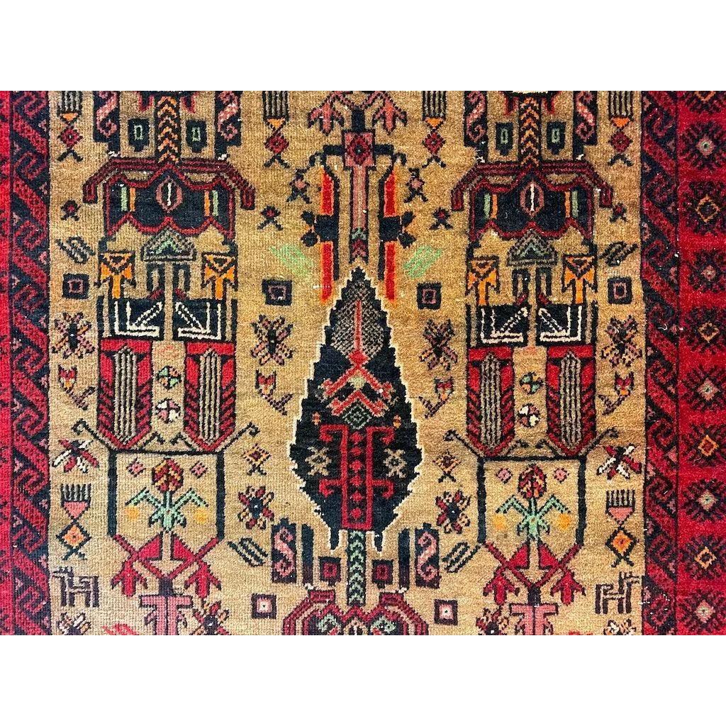 Vintage 1970s Persian Baluch rug with geometric floral patterns and natural wool pile