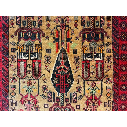Vintage 1970s Persian Baluch rug with geometric floral patterns and natural wool pile