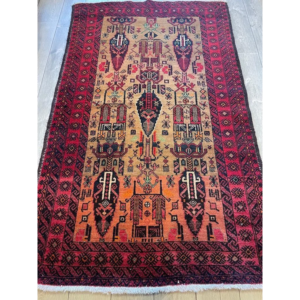 Stunning Persian Baluch rug with intricate geometric patterns and luxurious wool pile