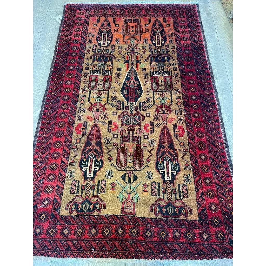 Vintage 1970s Persian Baluch rug with intricate geometric patterns in natural wool pile