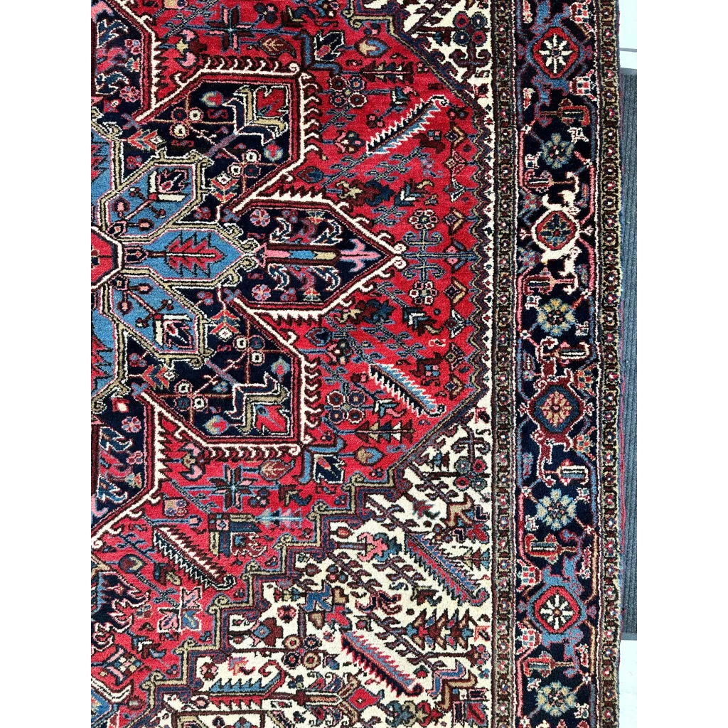 Vibrant Persian Heriz rug in red navy with geometric medallion design